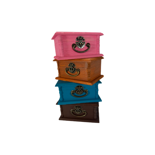 Four wooden stone treasure boxes shown together in rose pink, raw sienna, turquoise blue and burnt umber