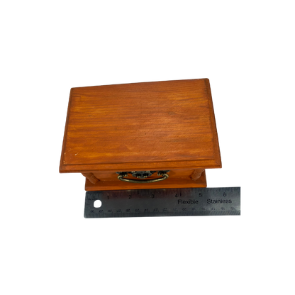Wooden stone treasure box shown with length measurement to show the overall size of the keepsake box