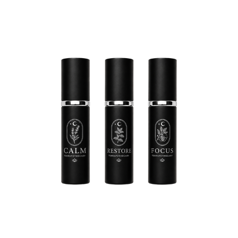 Collection of Terrapothecary essential oil blends including Calm, Restore, and Focus in 10 ml spray bottles made with pure essential oils.