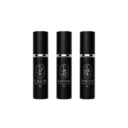 Collection of Terrapothecary essential oil blends including Calm, Restore, and Focus in 10 ml spray bottles made with pure essential oils.