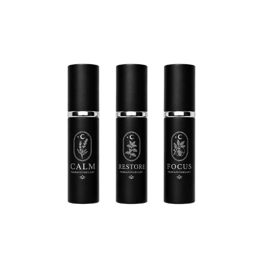 Collection of Terrapothecary essential oil blends including Calm, Restore, and Focus in 10 ml spray bottles made with pure essential oils.