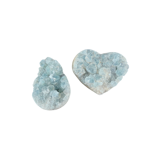 Natural pale blue Celestite geode with sparkling crystal formations and rounded mineral base