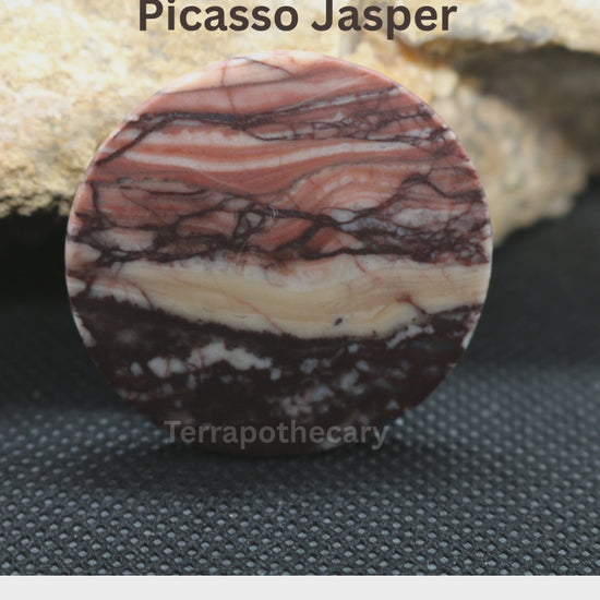 Video showing a hand-cut round Picasso Jasper cabochon with flowing layers of peach, rust, cream and dark brown, polished by Jody at Terrapothecary.