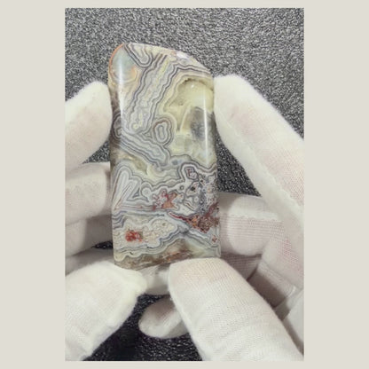 360-degree product video of a polished Crazy Lace Agate cabochon showcasing its colorful natural patterns, glossy finish, and handcrafted quality.