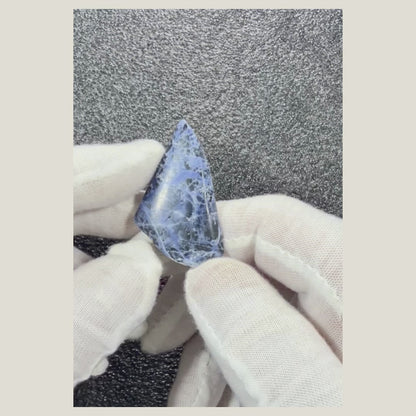 Video displaying a polished Sodalite cabochon from multiple angles to reveal its natural blue coloring.
