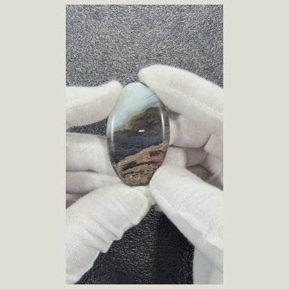 Close-up video of Natural Chalcedony Agate Cabochon highlighting natural banding and glossy finish