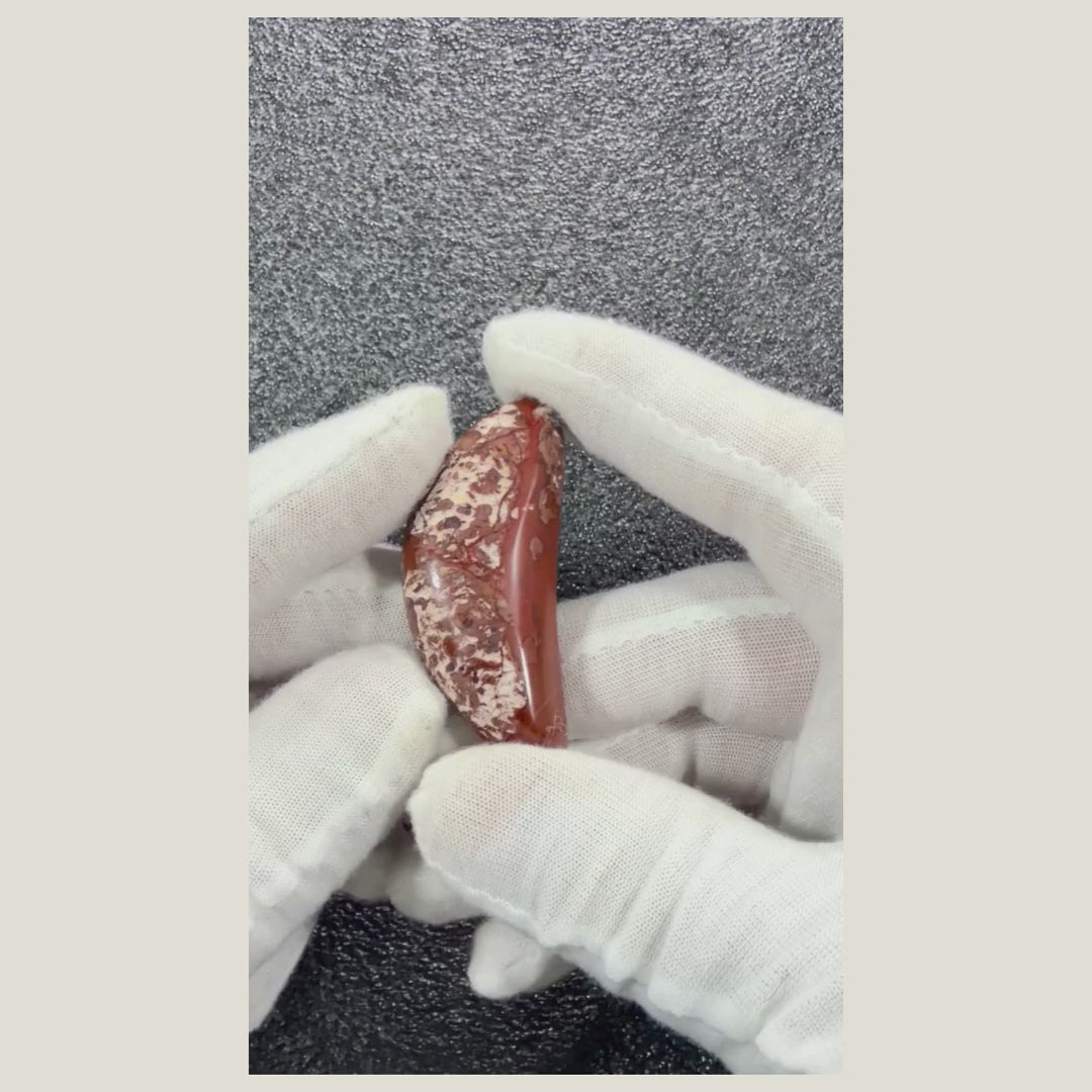 360-degree video of a genuine Brecciated Jasper cabochon showcasing its unique earthy colors and one-of-a-kind natural markings.