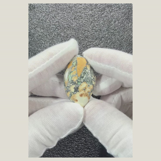 Video showing Maligano Jasper cabochon number 4 with polished jasper pattern and organic colors