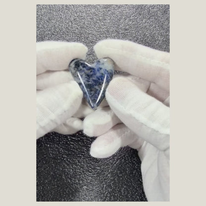 360-degree video of a natural Sodalite cabochon highlighting its polished finish, blue color, and white veining.