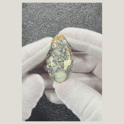 Video showing Maligano Jasper cabochon number 3 with earthy natural stone markings