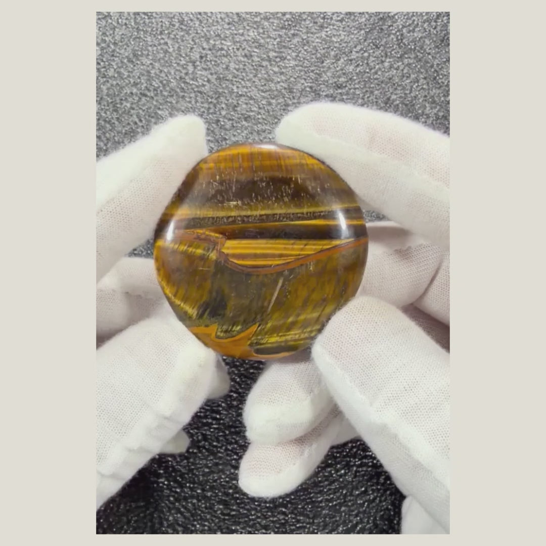 Natural Tiger's Eye cabochon featuring golden brown chatoyant bands, polished for jewelry making, wire wrapping, or bezel setting