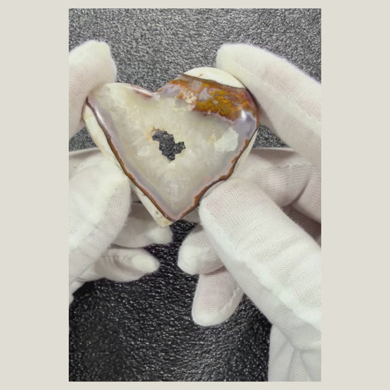 Rotating video of a heart-shaped Chalcedony Agate cabochon showcasing its polished finish and beautiful natural banding.
