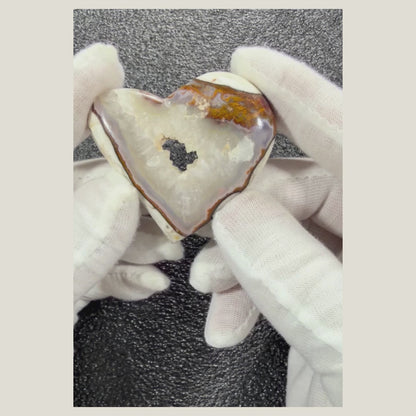 Rotating video of a heart-shaped Chalcedony Agate cabochon showcasing its polished finish and beautiful natural banding.