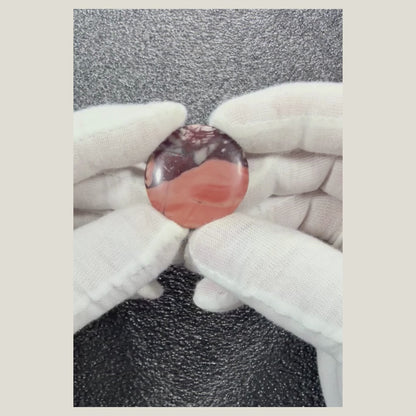 Rotating video showcasing a genuine Picasso Jasper cabochon with distinctive artistic veining and natural earth-tone colors.