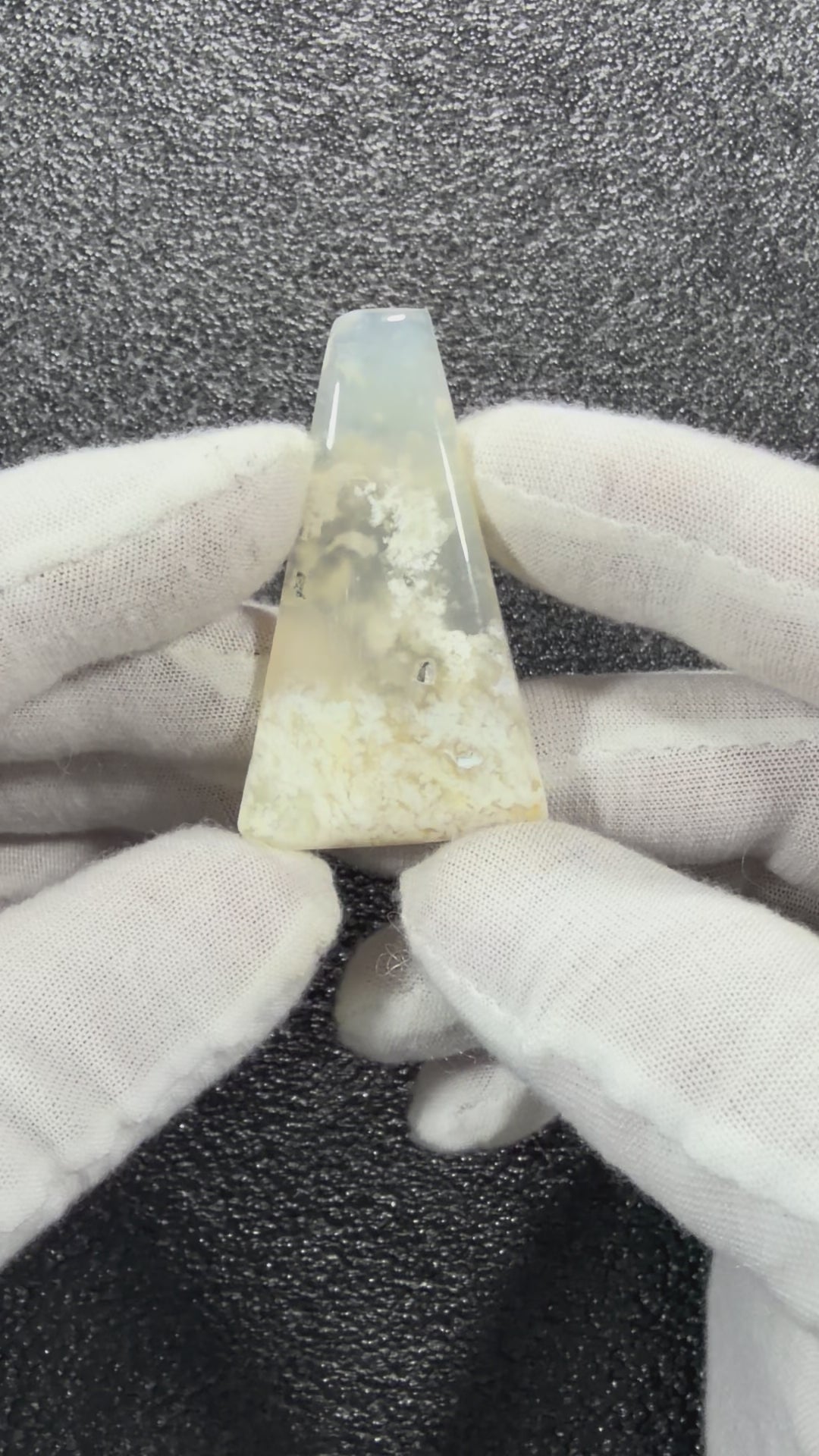 Close-up video of Natural Chalcedony Agate Cabochon highlighting natural banding and glossy finish